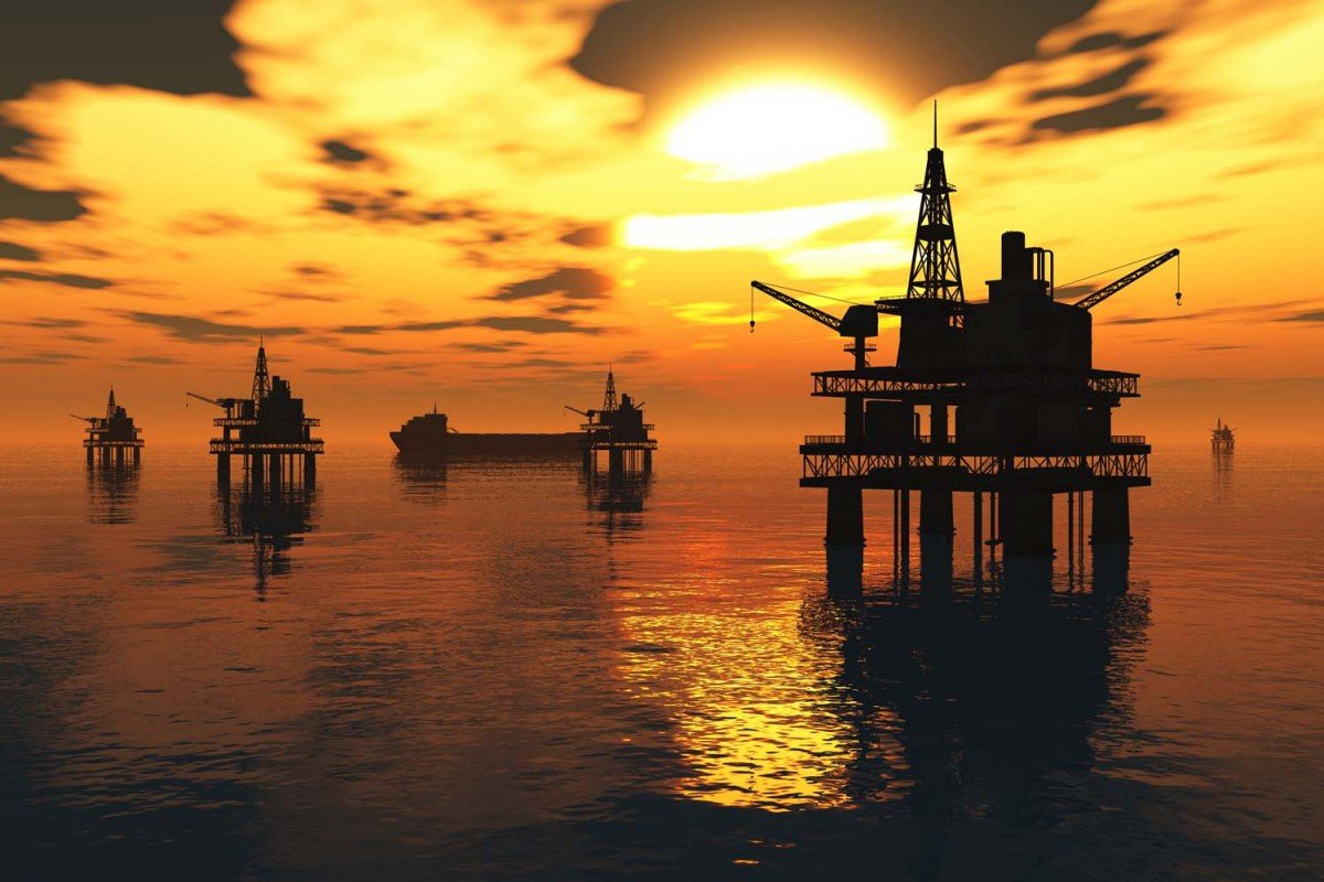 Offshore oil platforms at sunset — petroleum and oilfield operations
